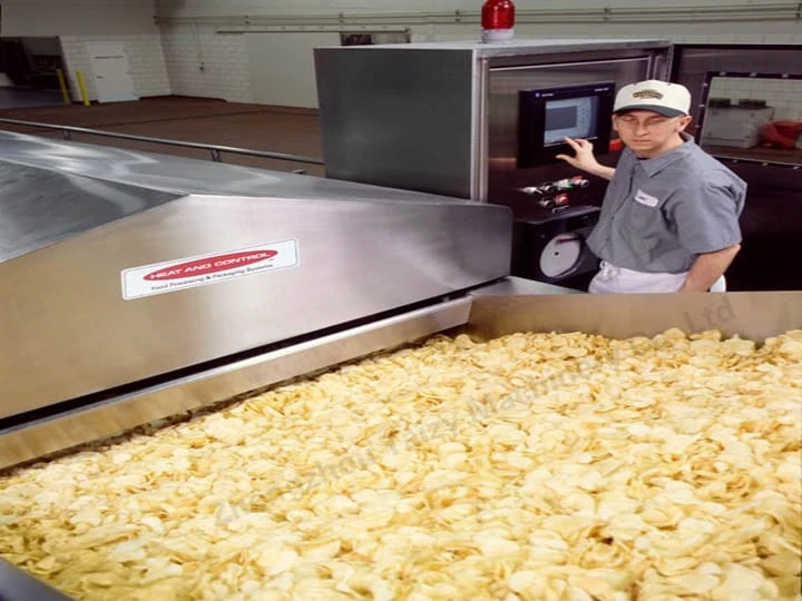 The potato chip production line is working efficiently.